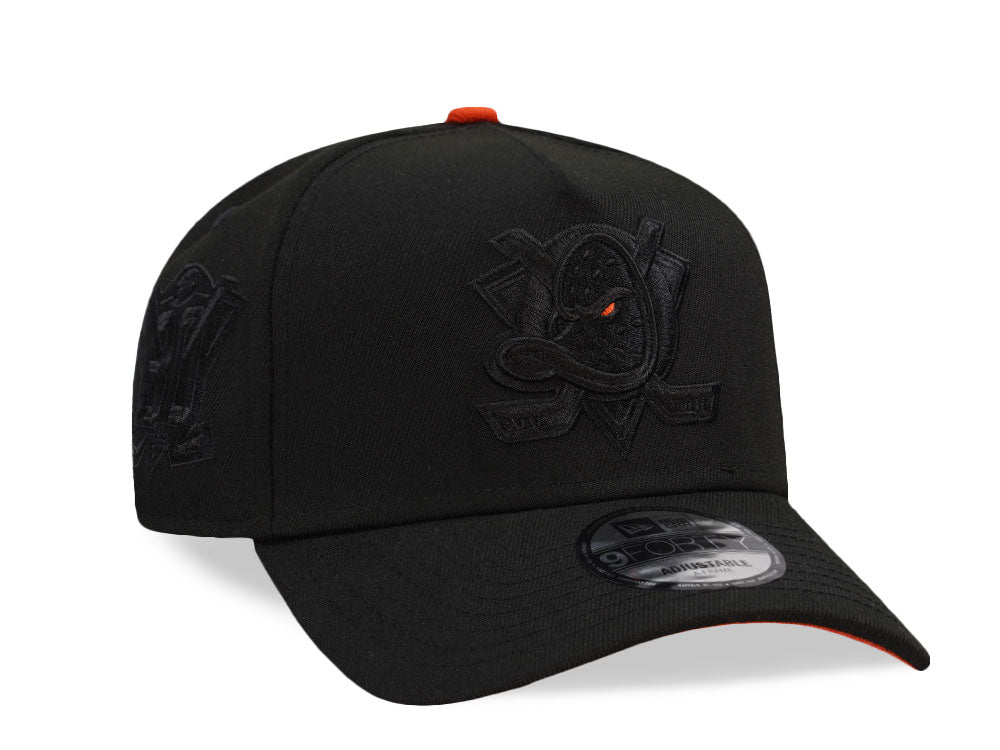 NEW ERA 9FORTY ANAHEIM DUCKS 30TH ANNIVERSARY BLACKOUT ORANGE POP